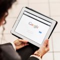 businesswoman on tablet using google search